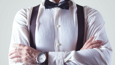 Arms Crossed with bow tie and suspenders - net2phone Canada - Business VoIP Phone System