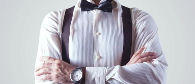 Arms Crossed with bow tie and suspenders - net2phone Canada - Business VoIP Phone System