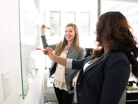 employee appreciation, happy people in front of a whiteboard