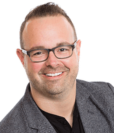 Headshot of Tyler Cooper, director of Client Services - net2phone Canada - Business VoIP Phone System