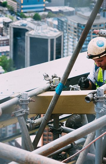 Construction worker on scaffold - D Grant Case Study- net2phone Canada - Business VoIP Phone System