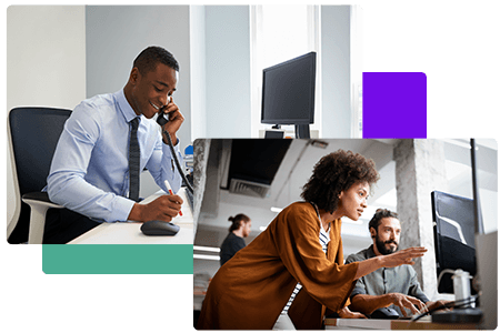 woman providing direction to man at computer and man sitting at his desktop on the phone smiling