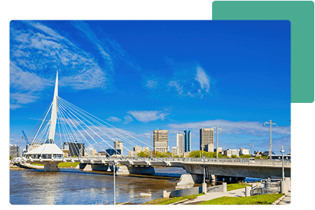 View of Manitoba business buildings from the bridge with water - net2phone Canada - Business VoIP Phone System