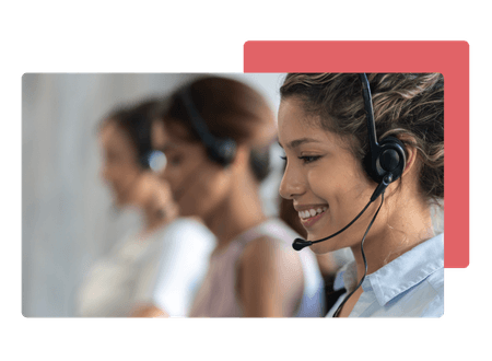 woman working at a call centre wearing headset smiling - net2phone Canada - Business VoIP Phone System