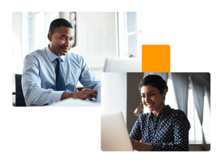 man and woman sitting at their respective laptops smiling