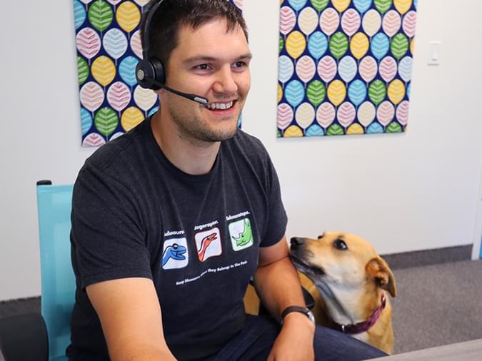 net2phone canada employee smiling talking on a headset