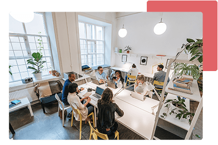 group of employees meeting in open concept working space