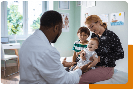 Healthcare - Doctor tending to baby patient with mom and child - net2phone Canada - Business VoIP Phone System