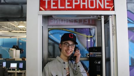 net2phone canada employee in a phone booth
