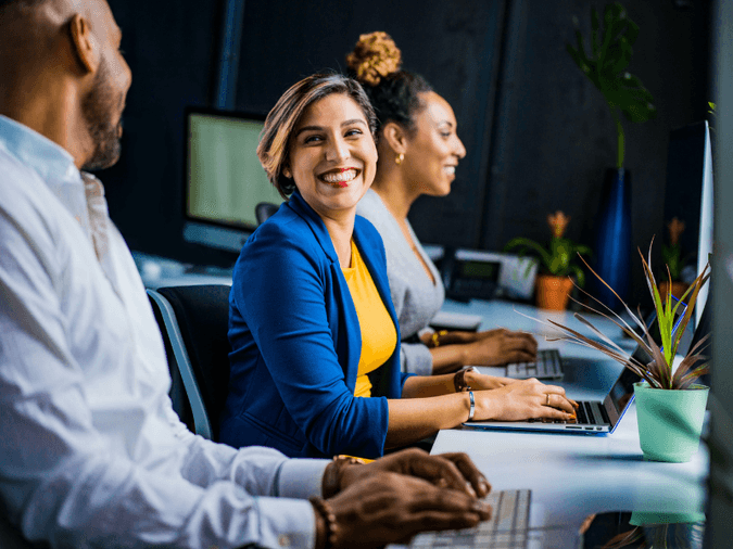 People working at their desks in an office setting