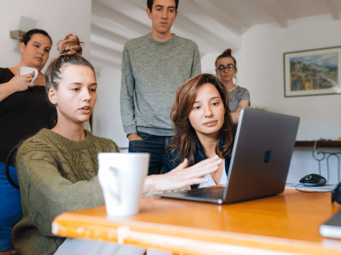 people in front of a computer