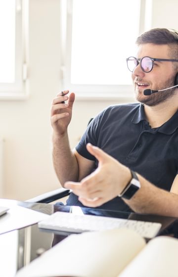 A man talking on a headset