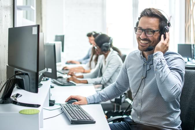 A man talking on a headset