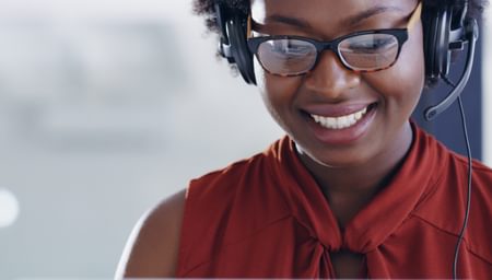 Smiling woman on a headset