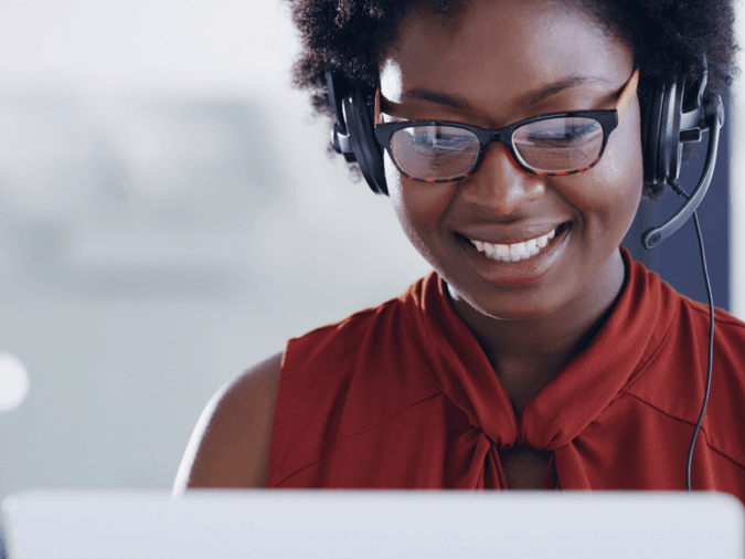 Smiling woman on a headset