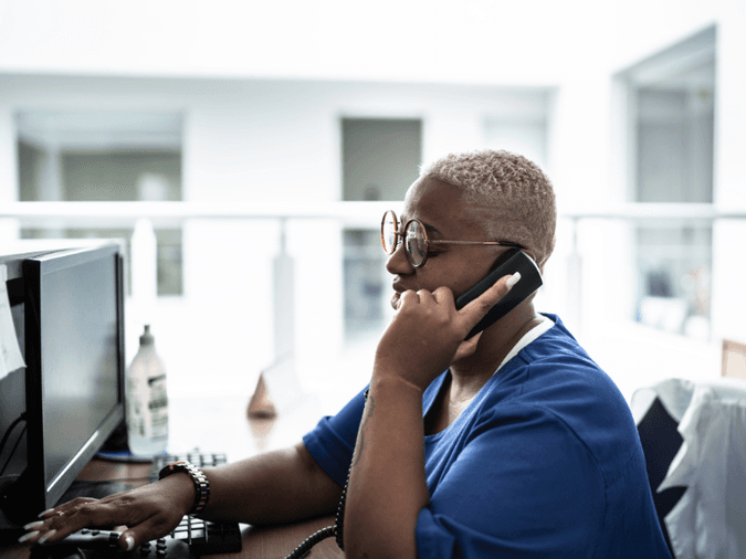 Woman on desk phone