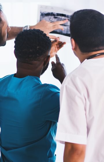 Doctors looking at an ultrasound