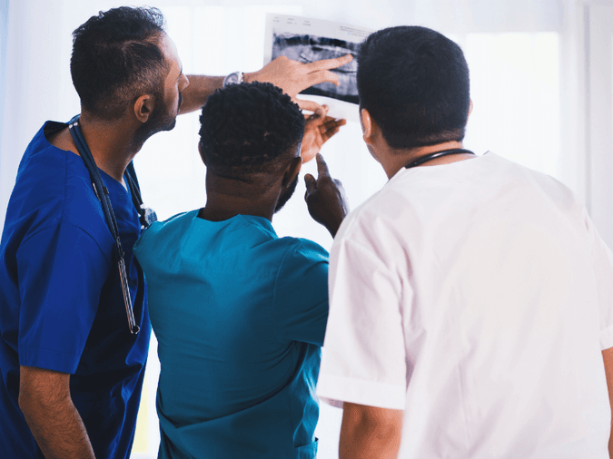 Doctors looking at an ultrasound