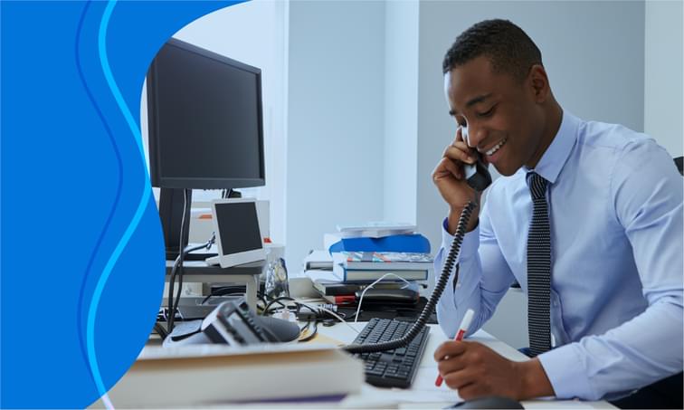 man-using-voip-at-desk