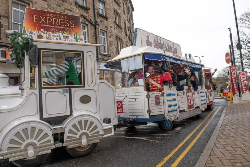 Christmas road train running on the street