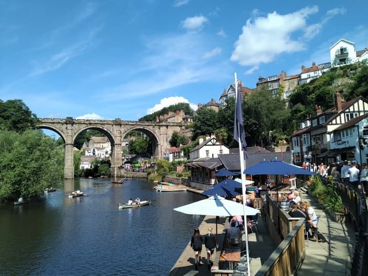 Viaduct over River Nidd lined with cafes