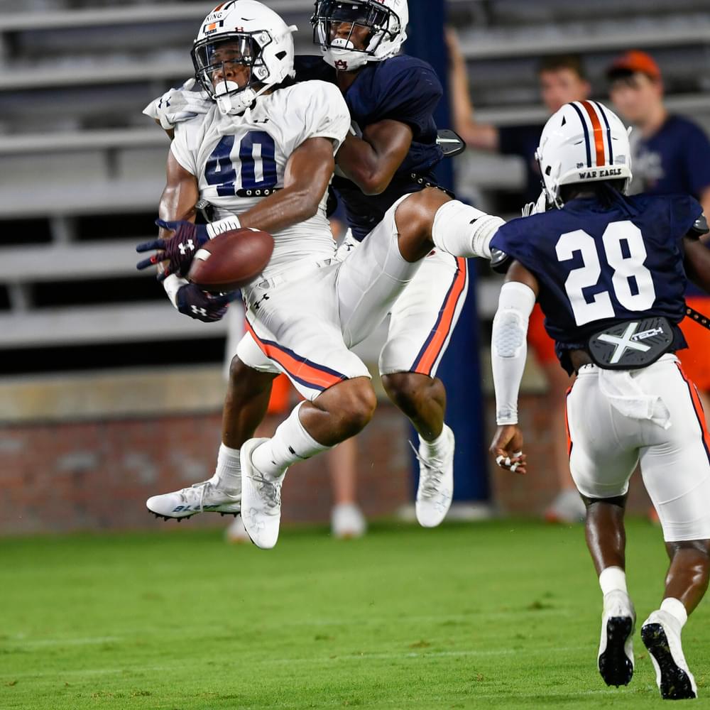 2 Landen King (40) is unable to hang-on defended by Trey Elston  (22). Auburn football scrimmage 1 on Saturday,  Aug. 14, 2021 in Auburn, Ala. Todd Van Emst/AU Athletics