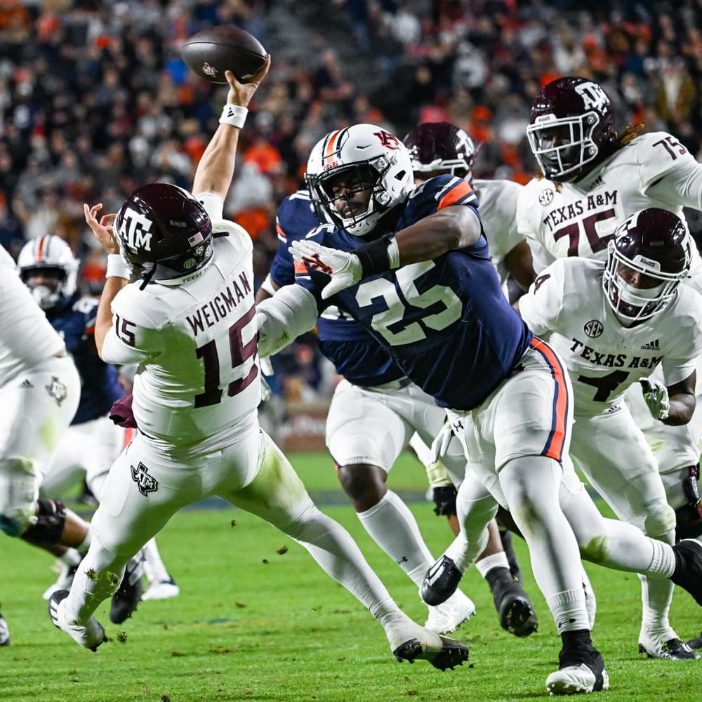 November 12, 2022; Auburn, Al, USA;  Colby Wooden (25) forces the quarterback to throw off balance during the game between Auburn and Texas A&M at Jordan-Hare Stadium.  Todd Van Emst/AU Athletics Alabama News