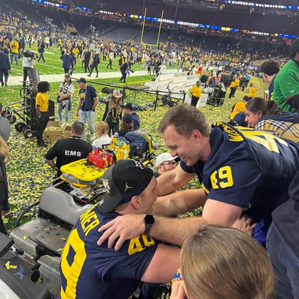 Michigan long snapper William Wagner congratulated by family after winning national championship. Alabama News