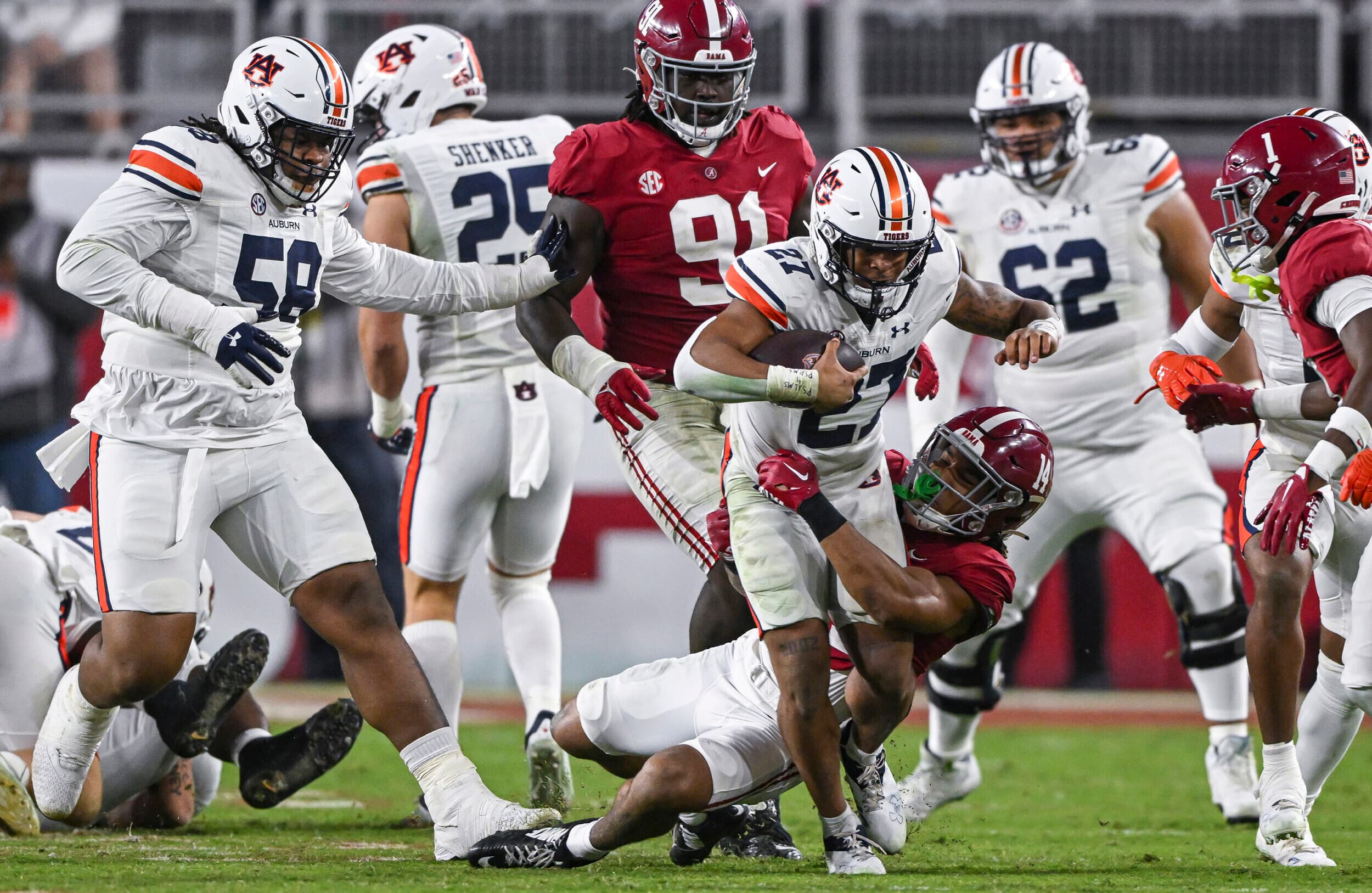 Nov 26, 2022; Tuscaloosa, Al, USA; Jarquez Hunter (27) tries to break the tackle during the game between Auburn and Alabama at Bryant-Denny Stadium.