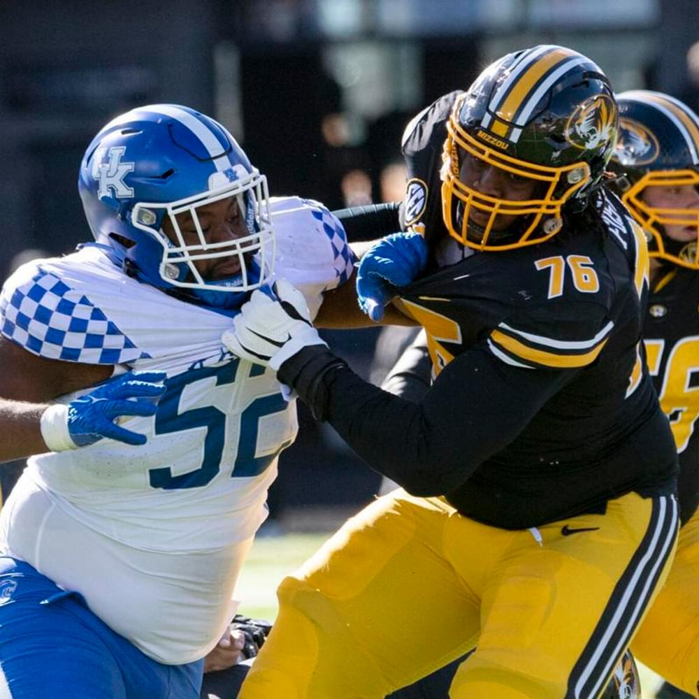 Kentucky defensive lineman Justin Rogers, left, fights his way past Missouri’s Javon Foster, right, during a game Saturday, Nov. 5, 2022, in Columbia, Mo.  L.G. Patterson