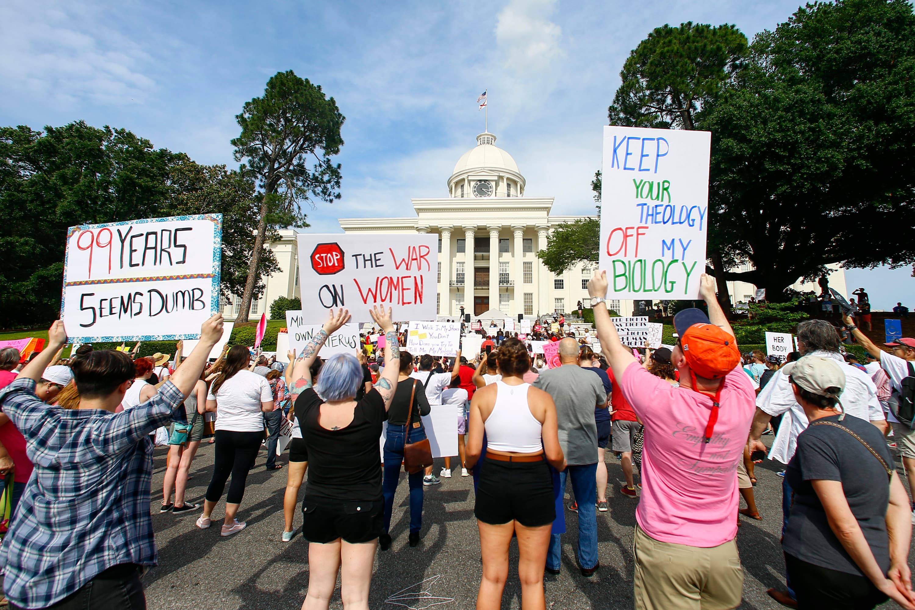 Protesters for women's rights hold a rally on the Alabama Capitol steps to protest a law passed the week before making abortion a felony in nearly all cases with no exceptions for cases of rape or incest, Sunday, May 19, 2019, in Montgomery, Ala.