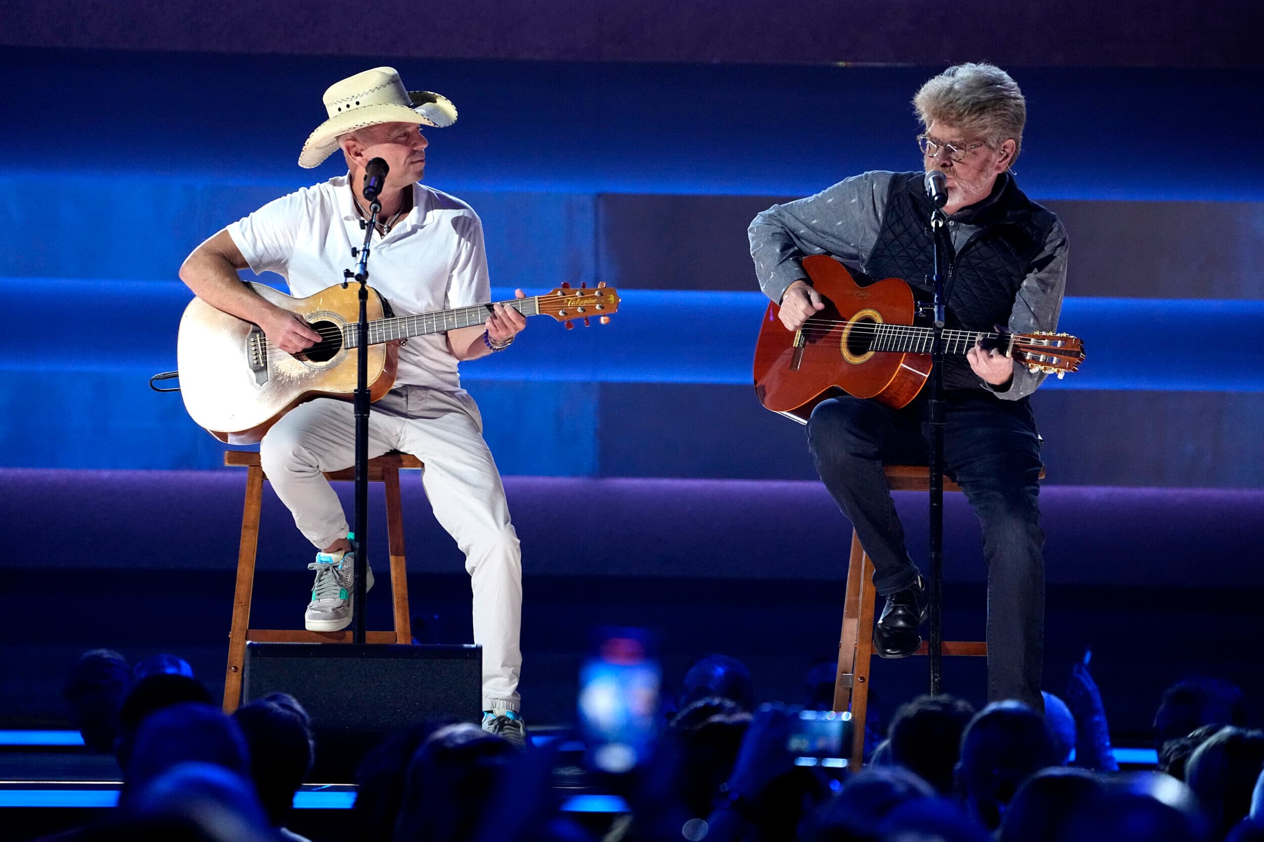 Kenny Chesney, left, and Mac McAnally perform a tribute to Jimmy Buffett at the 57th Annual CMA Awards on Wednesday, Nov. 8, 2023, at the Bridgestone Arena in Nashville, Tenn.