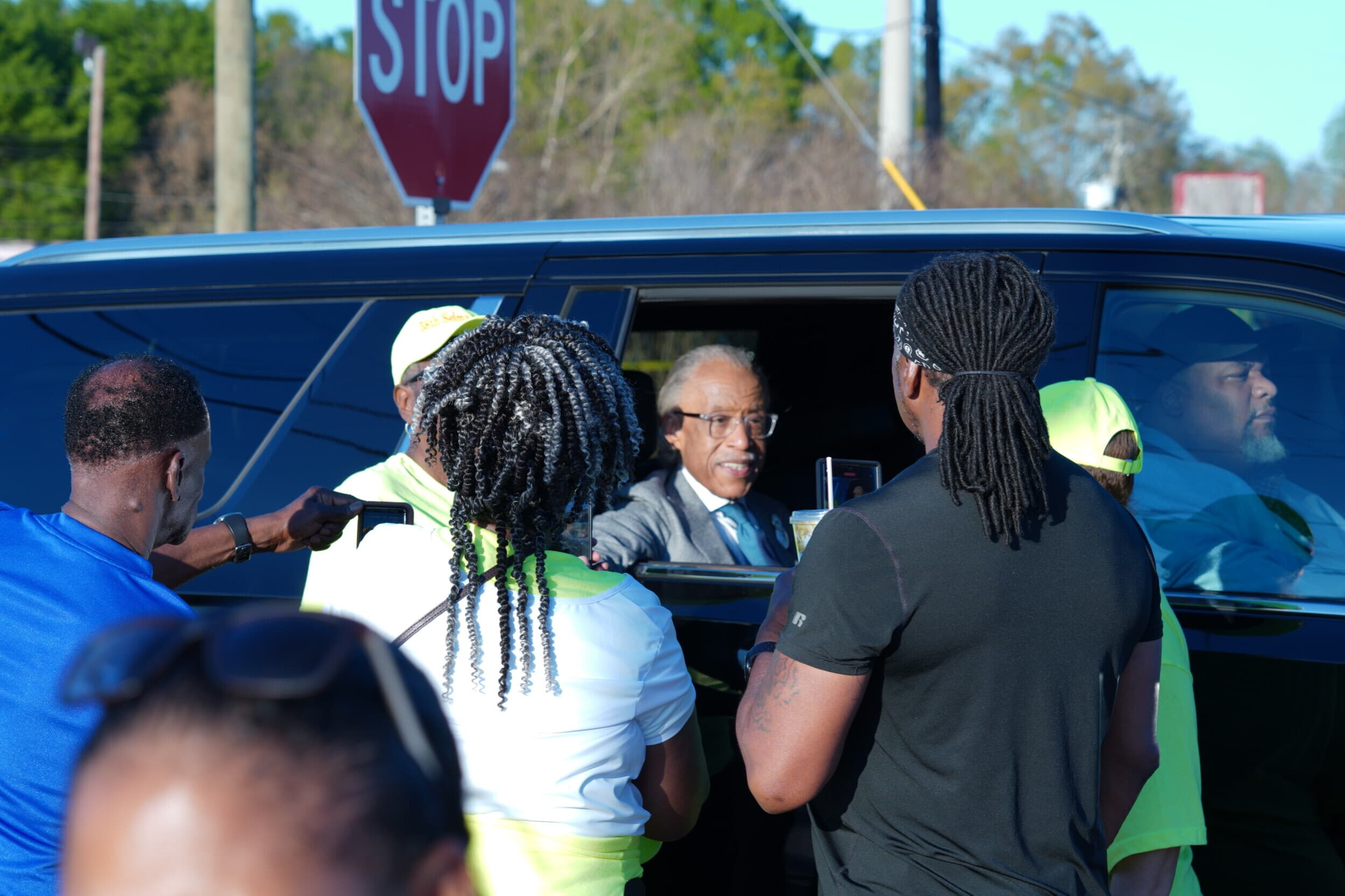 Rev. Al Sharpton speaks to marchers at the foot of the Edmund Pettus Bridge. Photo: Craig Monger.