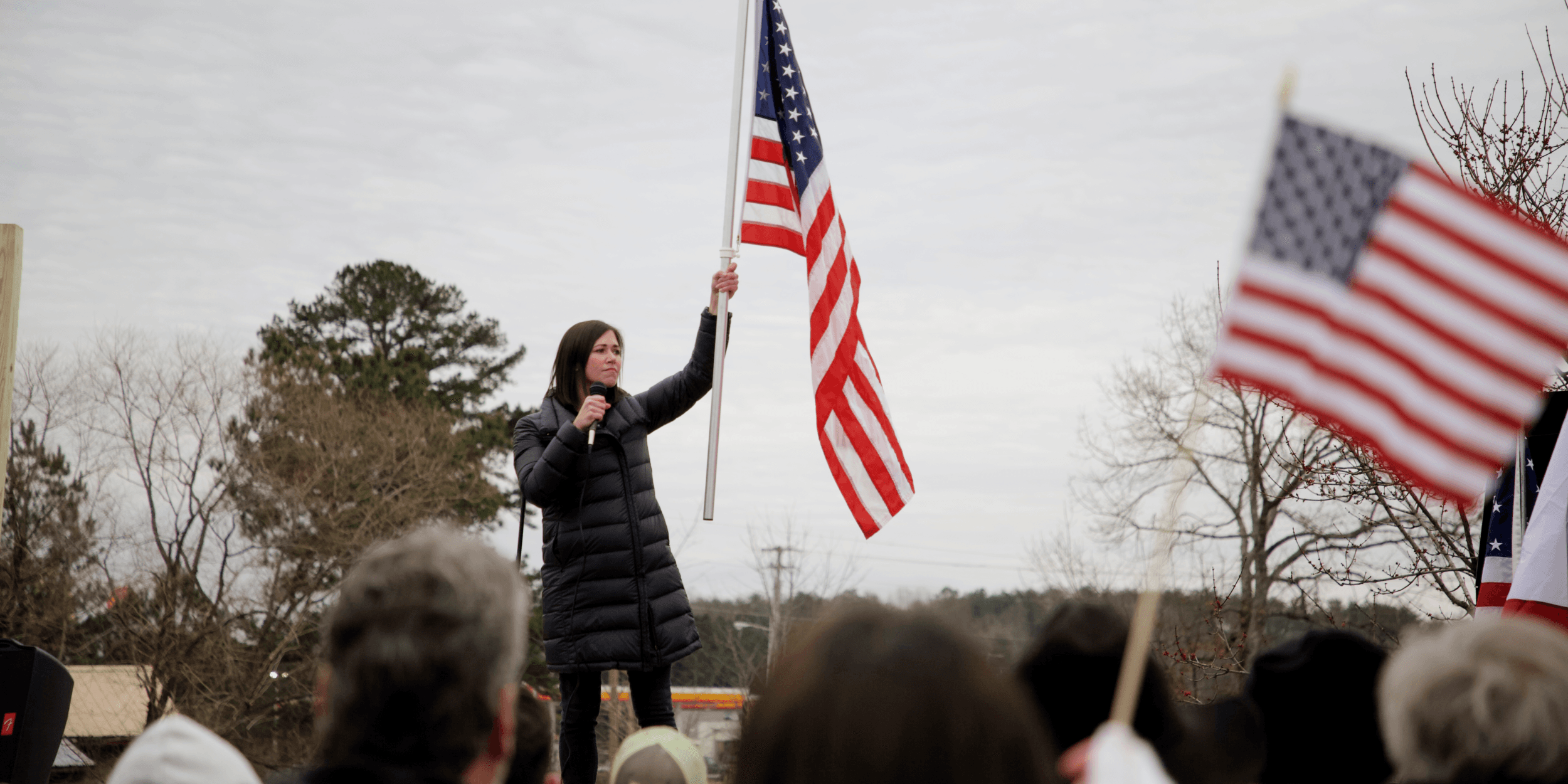 Katie Britt waving flag