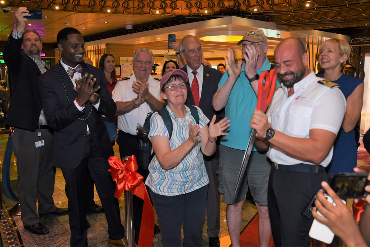 Mobiles first guests to board Carnival Spirit cut a ceremonial ribbon with Captain Salvatore Siviero Mobile Mayor Sandy Stimpson and Sarah Beth Reno Carnivals SVP of guest operations