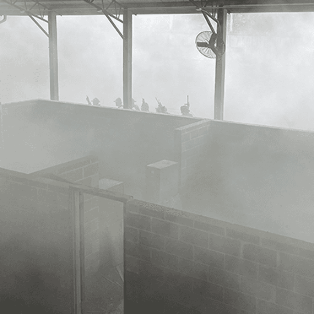 Smoke fills up the training facility as trainees approach to conduct an active shooter simulation Alabama News