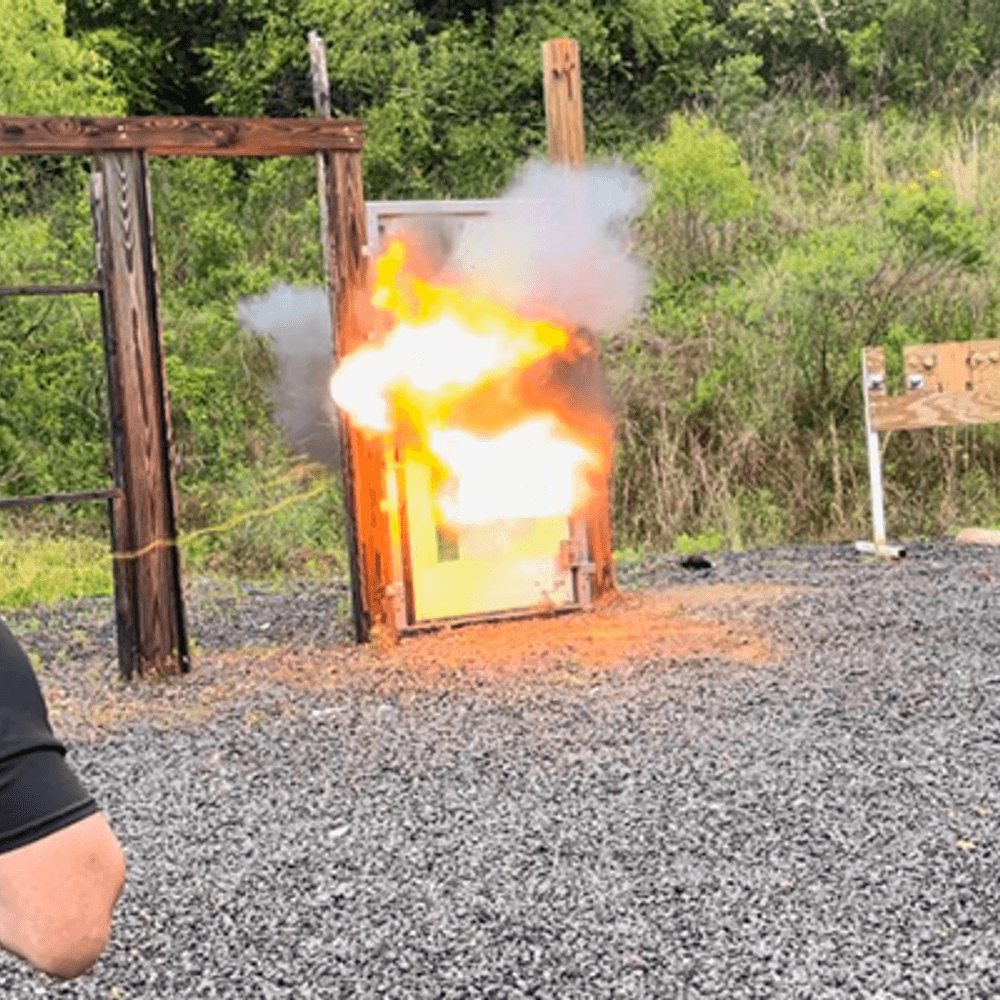 Trainees watch as CRG trainers demonstrate how to use an explosive breaching device Alabama News