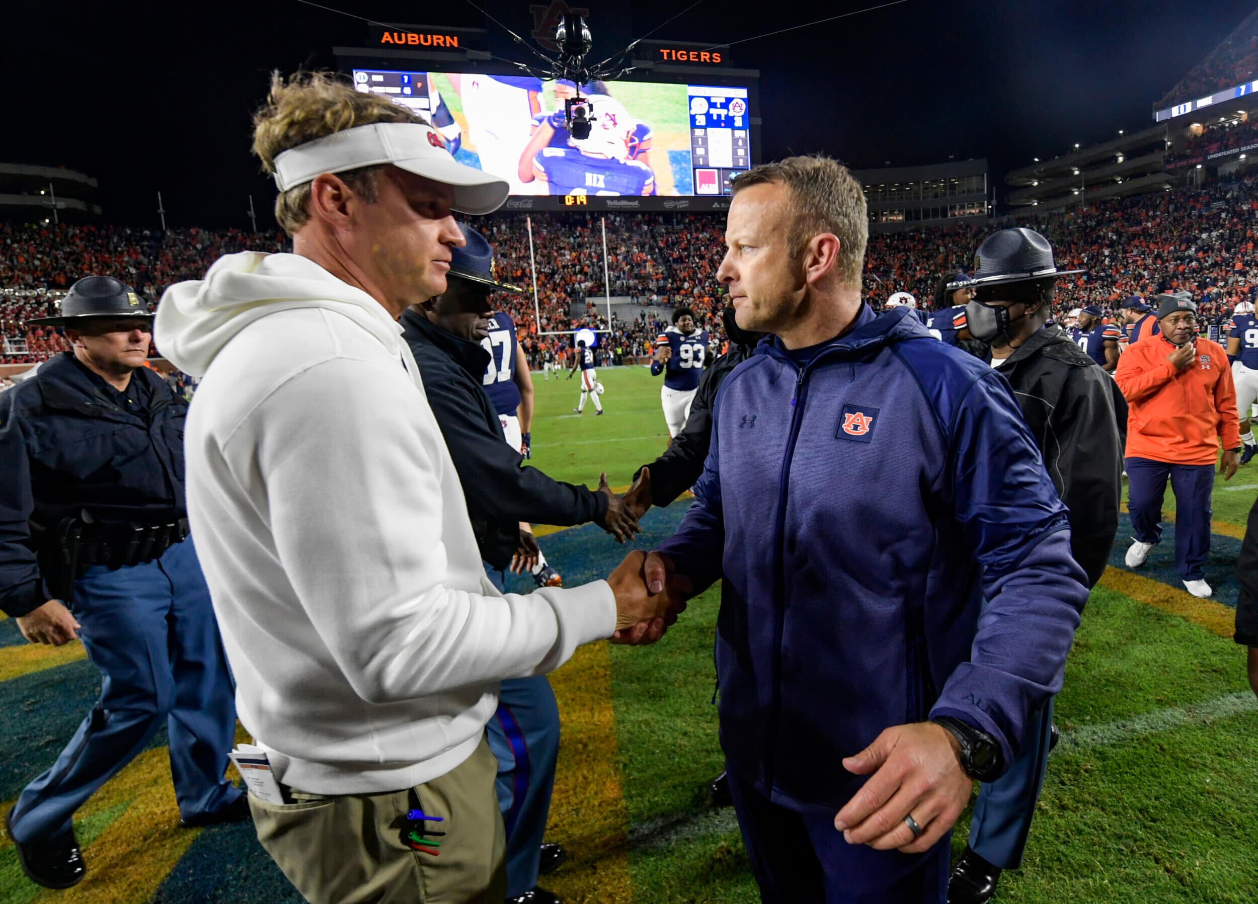 Auburn, AL, USA; Coach Bryan Harsin reacts with Lane Kiffin after the game between Auburn and Ole Miss at Jordan-Hare Stadium.