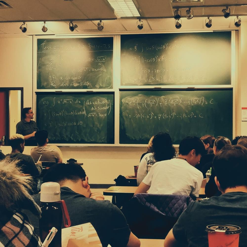 Classroom blackboards and teacher