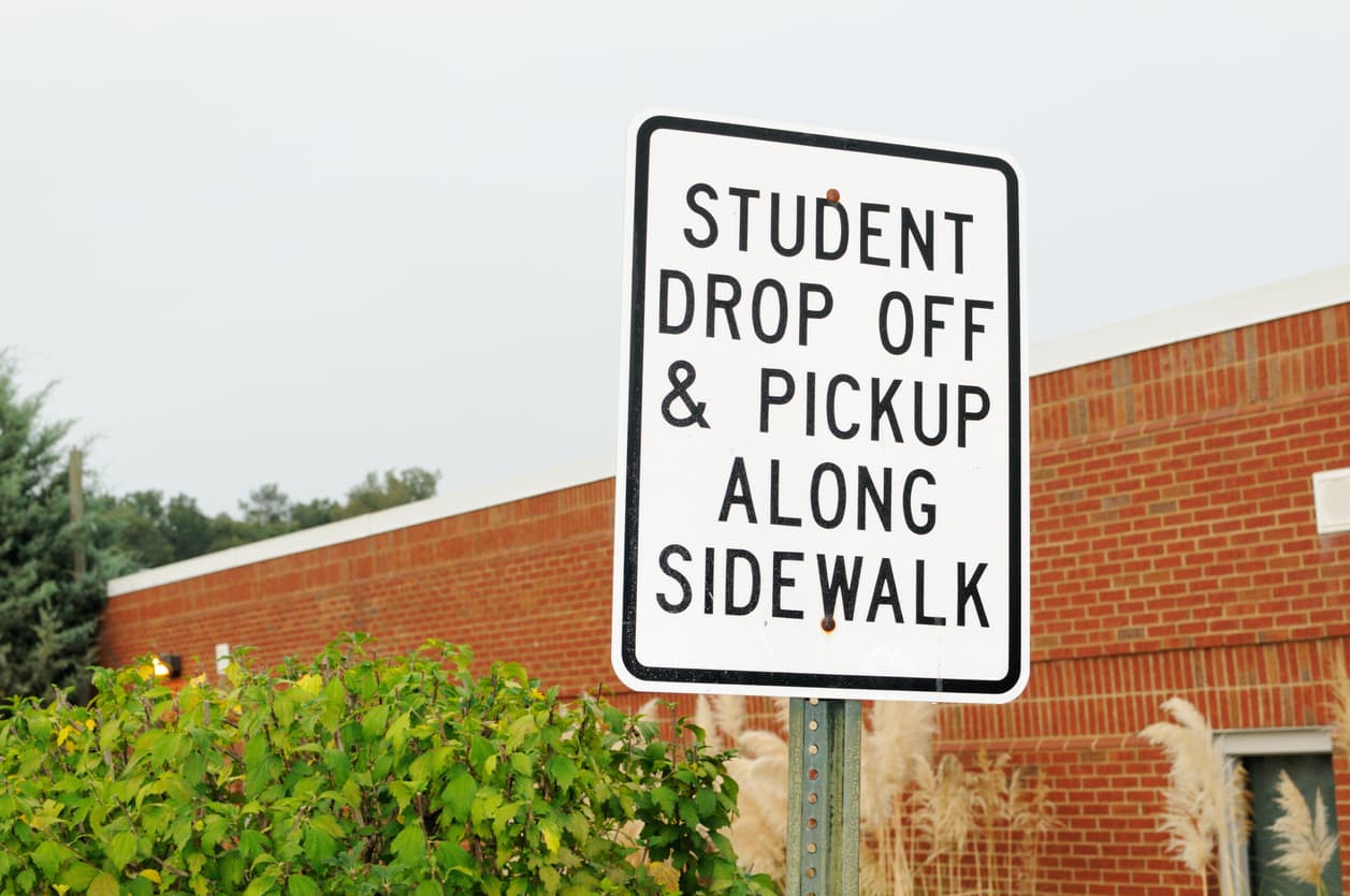 Student drop off and pickup sign stock photo