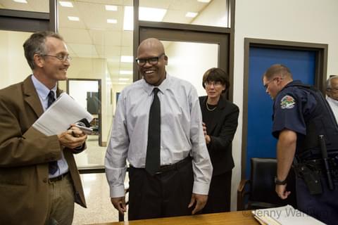 Leon Brown smiles with his attorneys as he is exonerated.