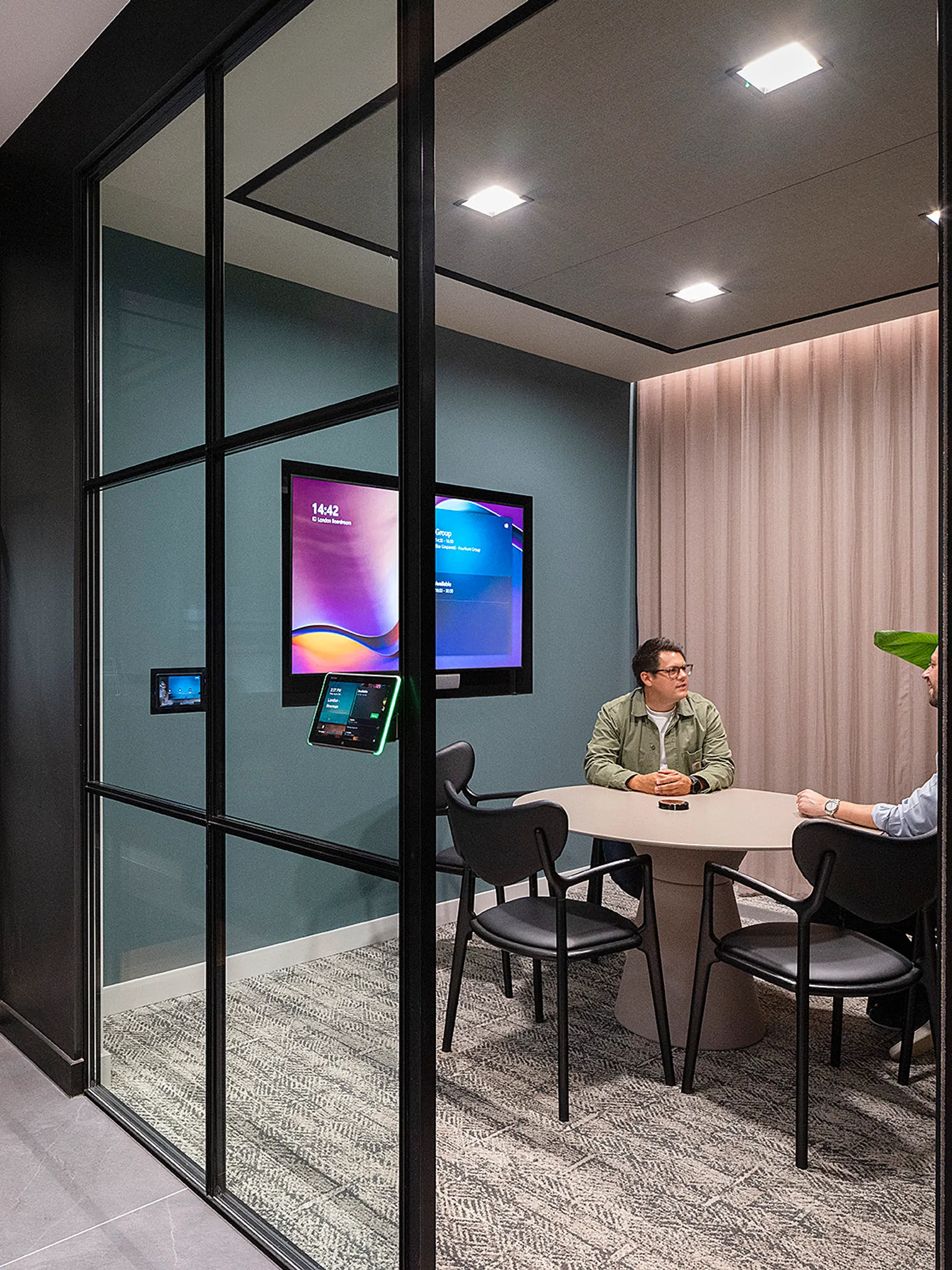 Well lit office space with glass wall for collaborative space