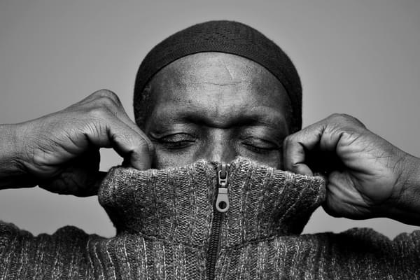 Tony Allen Bernard Benant pulling on sweater