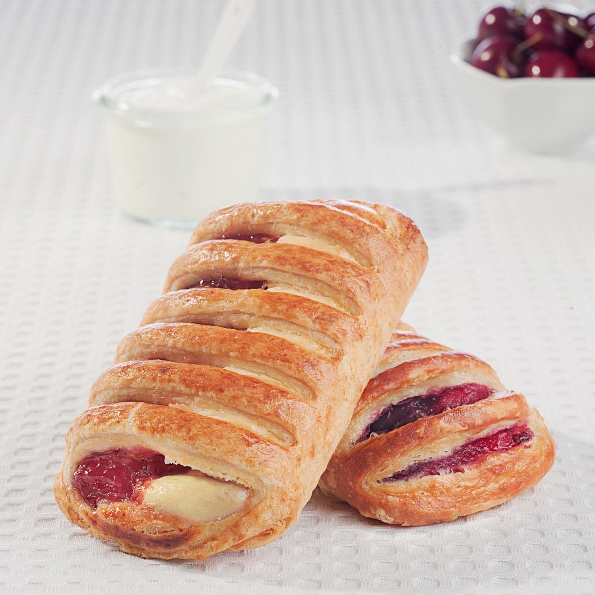 two greek yogurt cherry danishes piled up