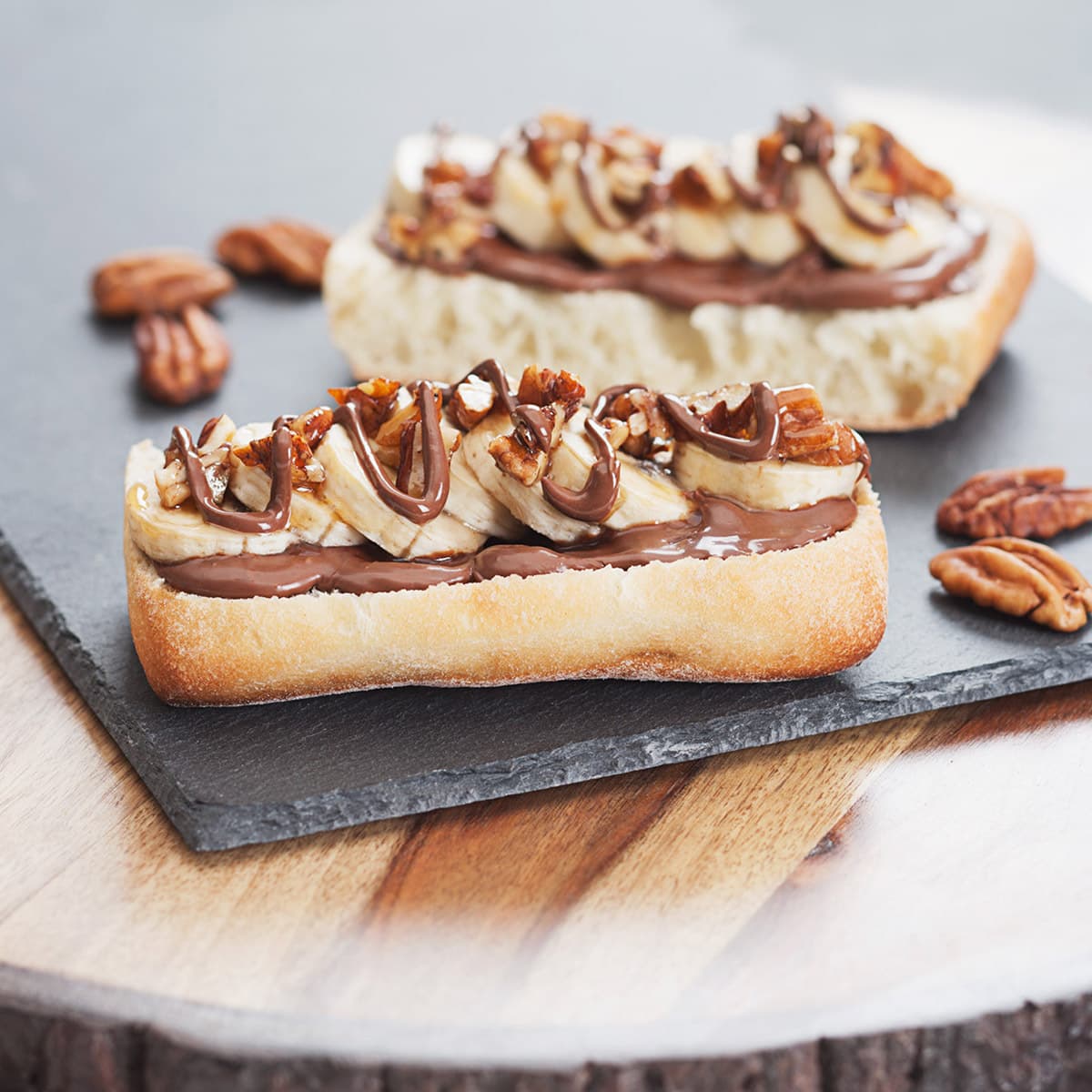 slices of white ciabatta artisan soft bread with chocolate and bananas