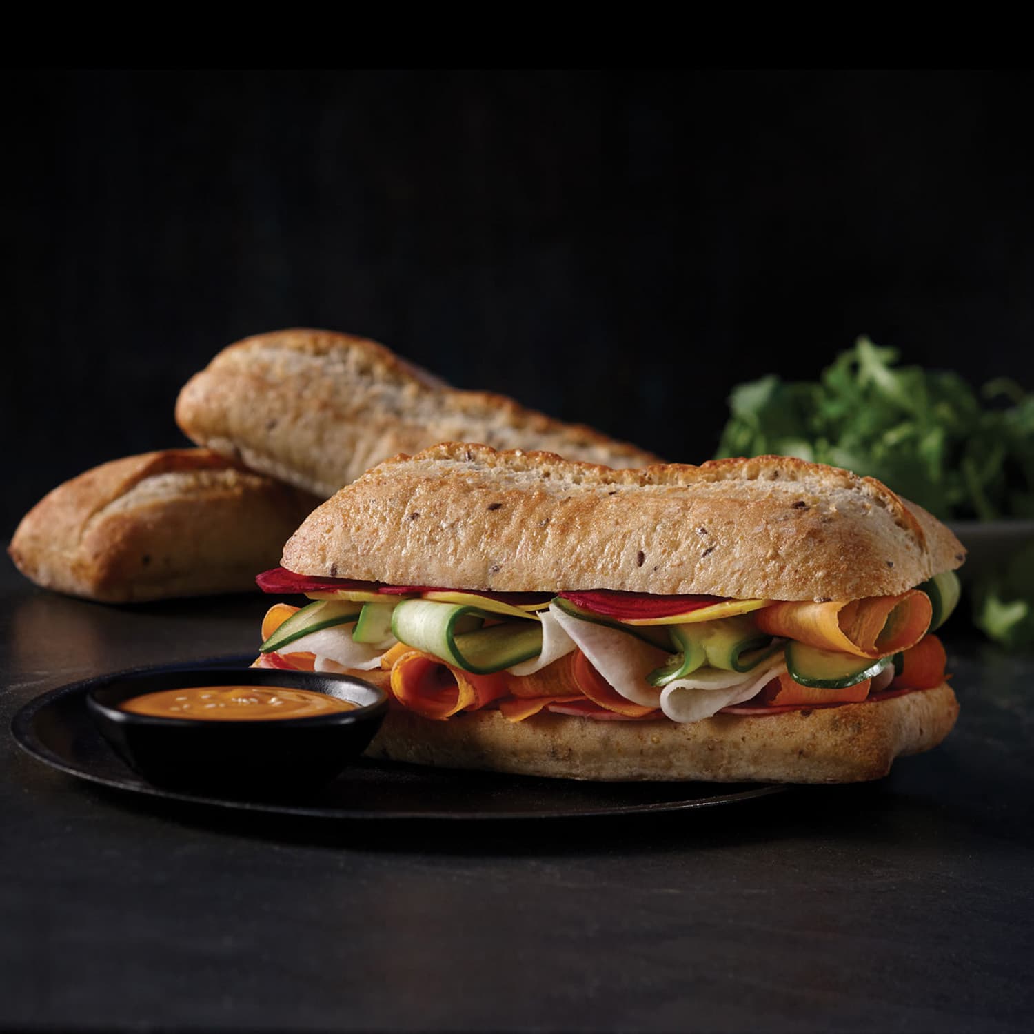 sliced multigrain baguettine sandwich and its sauce