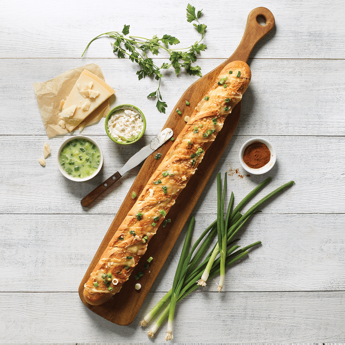 French Baguette - BBQ recipe with melted cheese, green onions and garlic butter