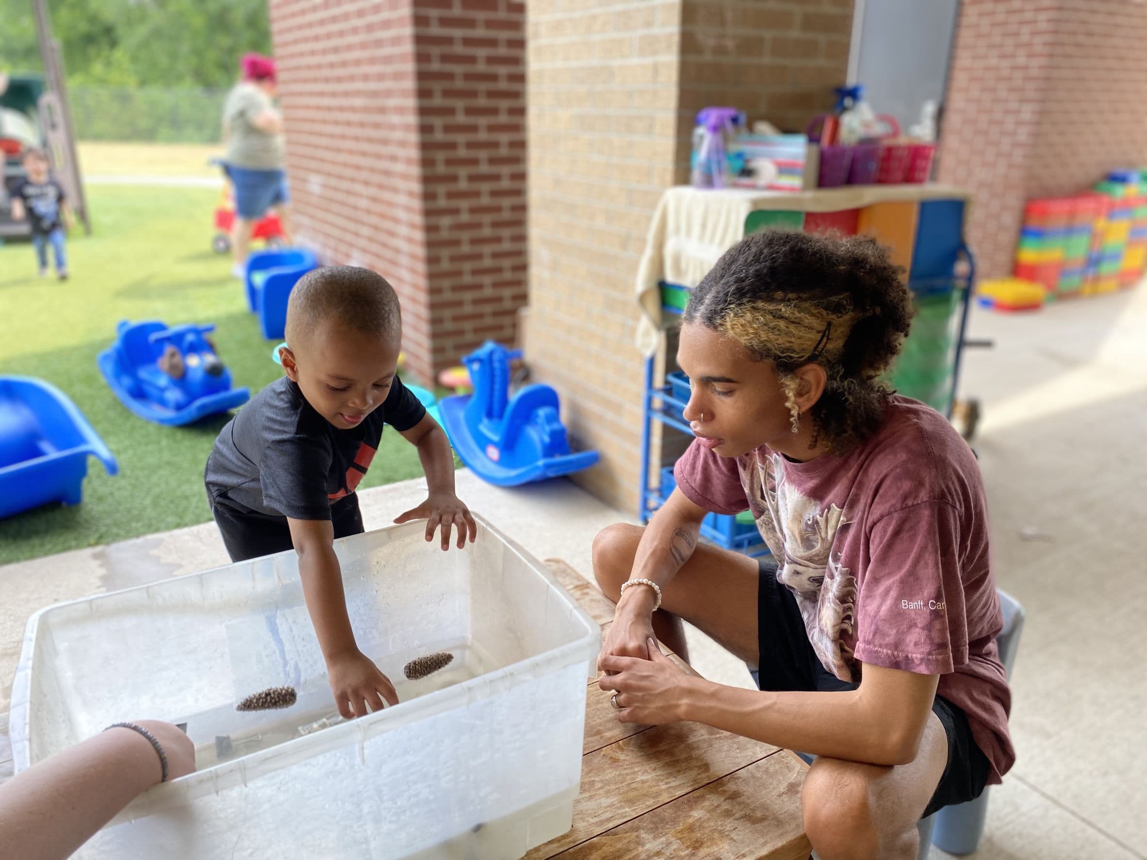 teacher child playing with blocks