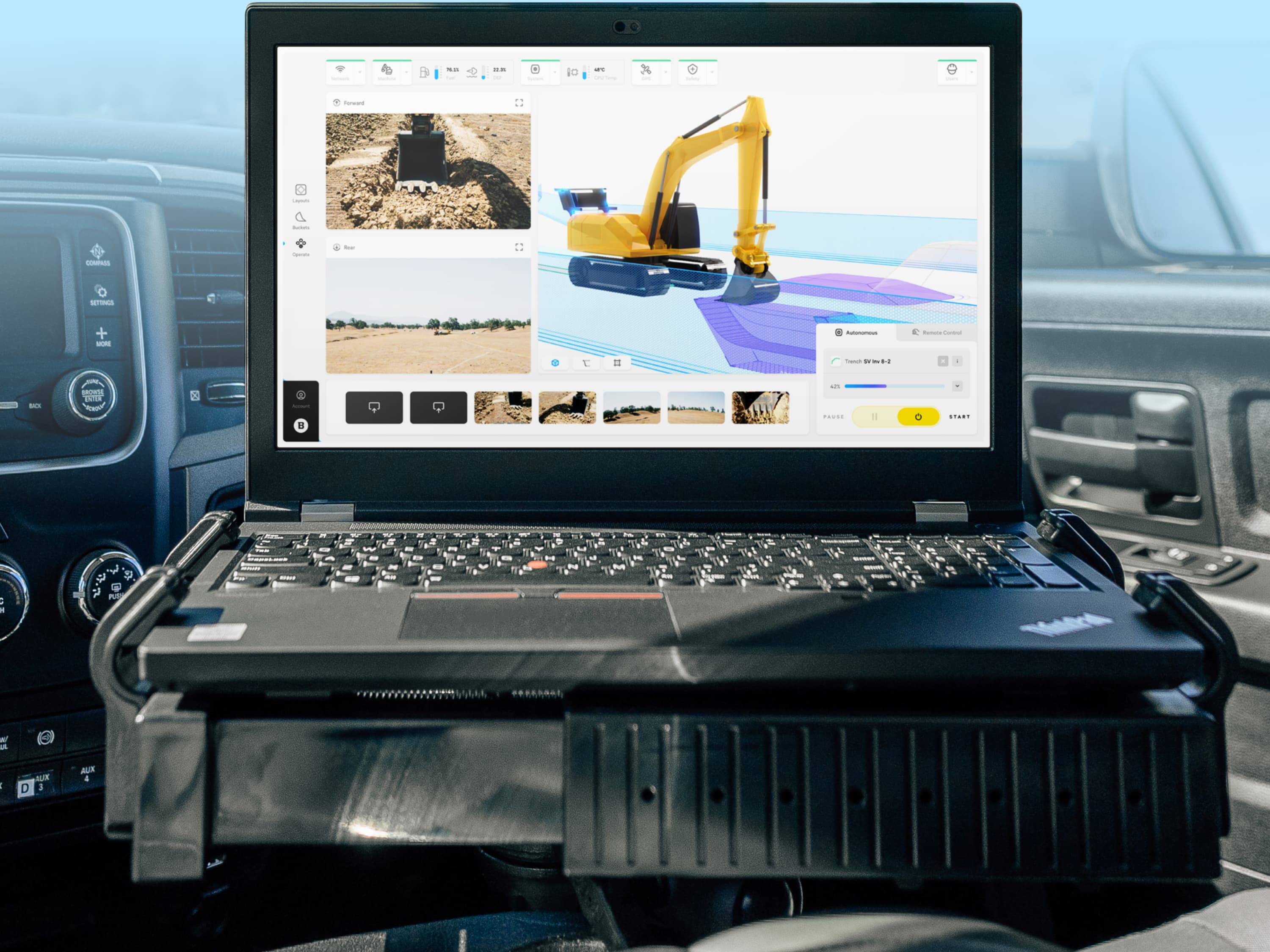 The Software Program, Everest, Running inside a Truck. On the Screen, an Autonomous Excavator Digs a Trench.