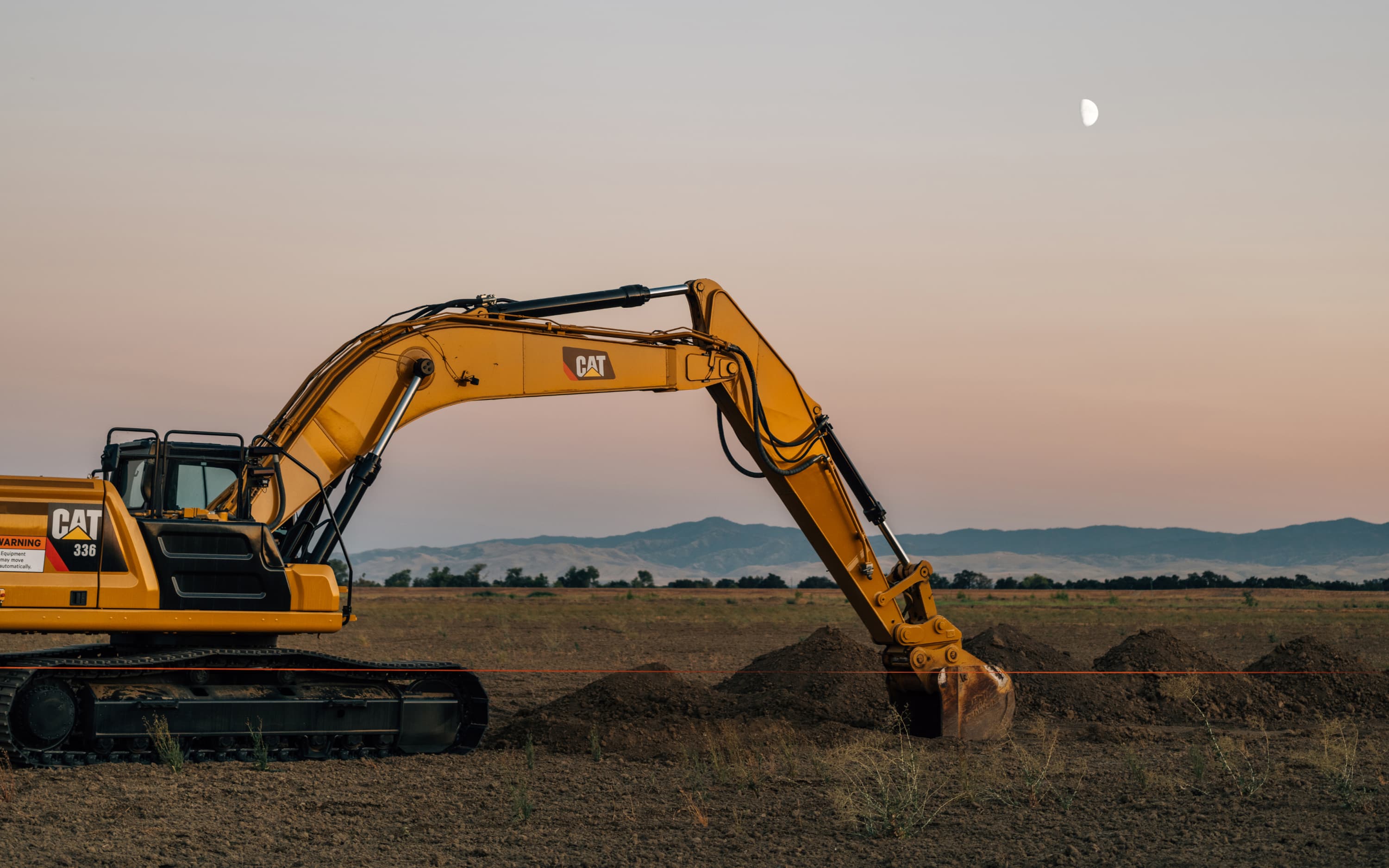 Excavator working dusk exosystem